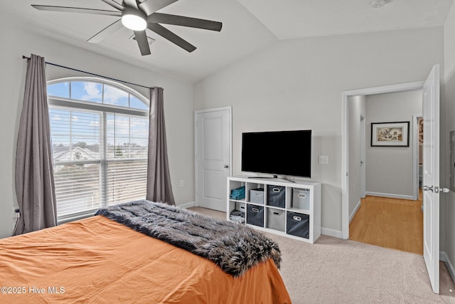 bedroom featuring lofted ceiling, carpet, and ceiling fan