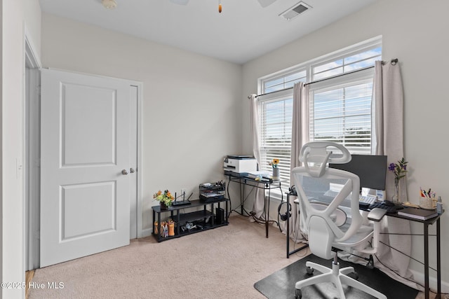 office space with light colored carpet