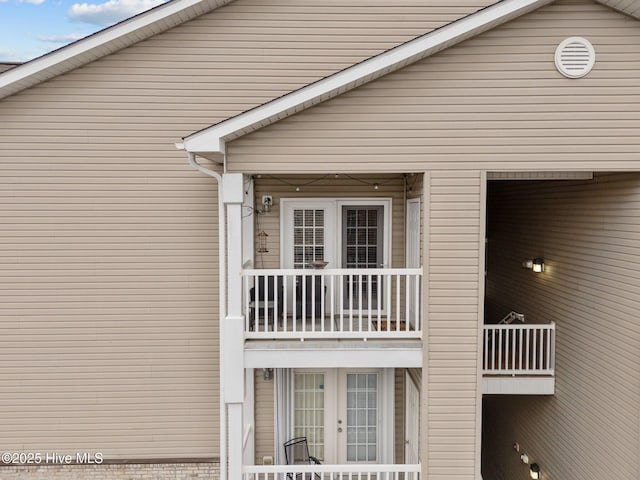 exterior space with french doors and a balcony