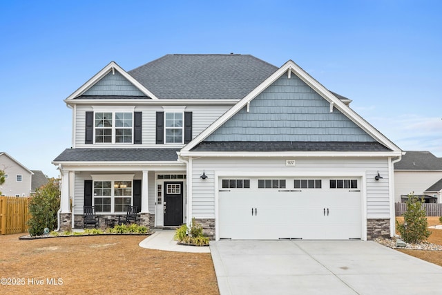 craftsman house with a garage and a porch