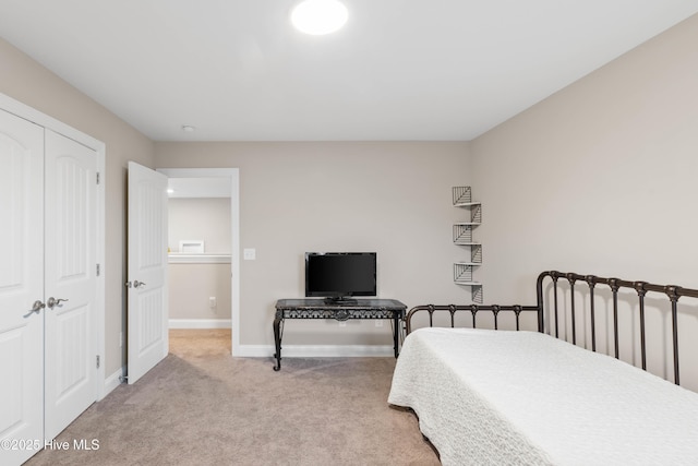 carpeted bedroom featuring a closet