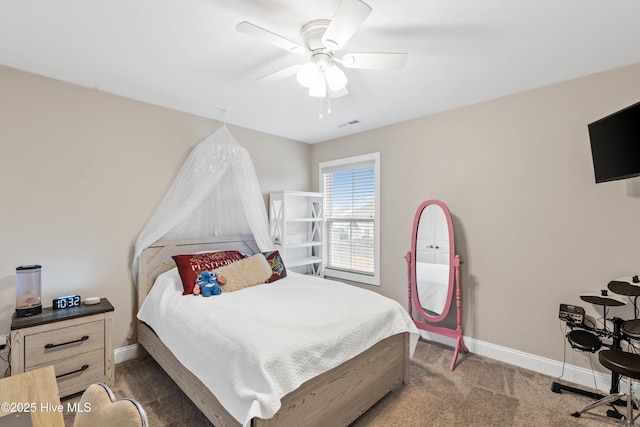 bedroom with ceiling fan and dark colored carpet