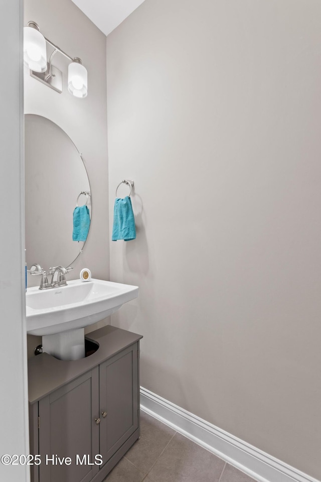 bathroom featuring tile patterned flooring and vanity