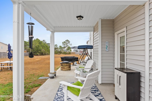 view of patio / terrace featuring a fire pit