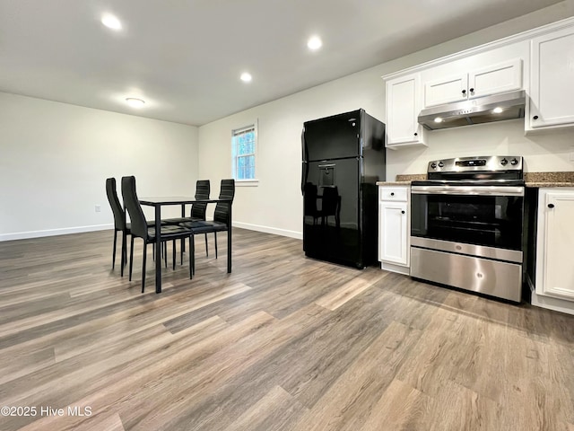 kitchen with electric stove, black fridge with ice dispenser, light hardwood / wood-style floors, and white cabinetry