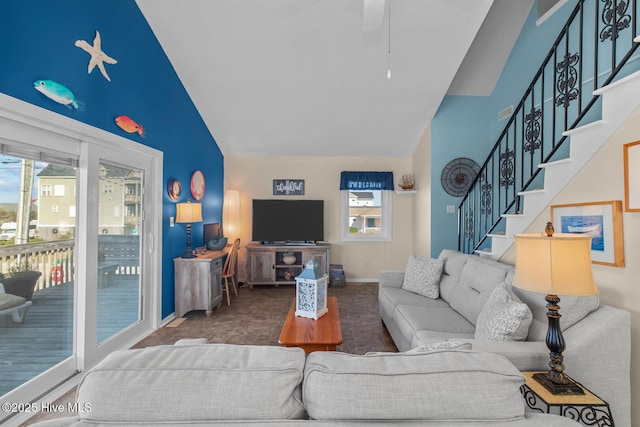 living room featuring high vaulted ceiling