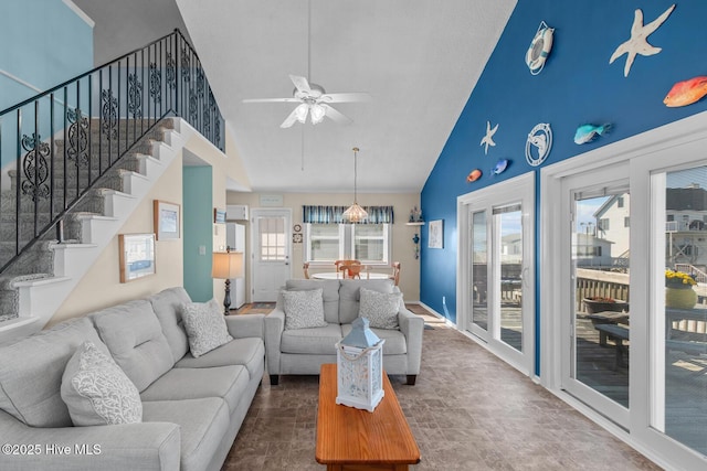 living room featuring high vaulted ceiling and ceiling fan