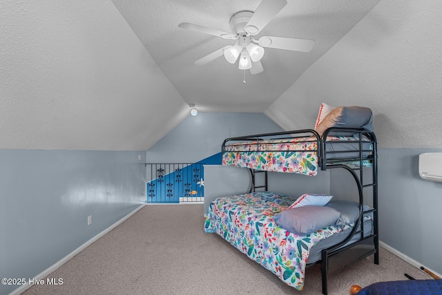 carpeted bedroom featuring ceiling fan, lofted ceiling, a wall unit AC, and a textured ceiling