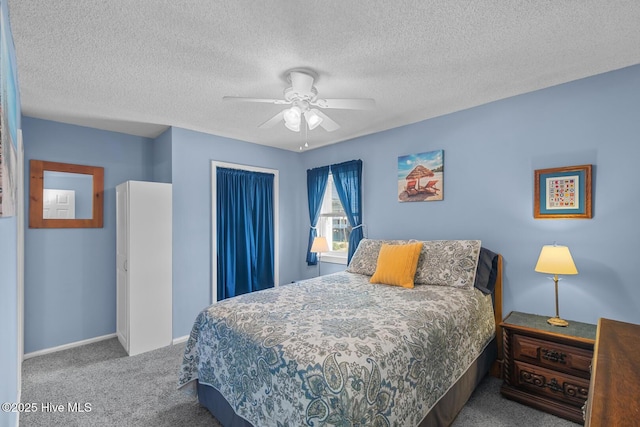 bedroom with ceiling fan, light colored carpet, a closet, and a textured ceiling