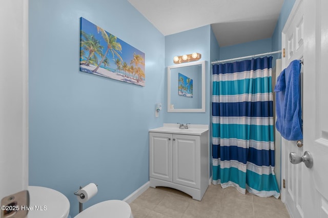 bathroom featuring tile patterned flooring, vanity, walk in shower, and toilet