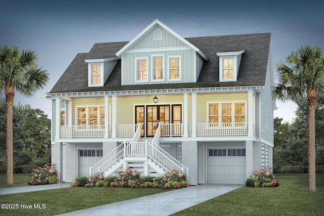 coastal home with covered porch, roof with shingles, stairway, and an attached garage