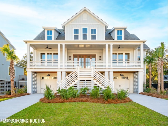 raised beach house featuring a ceiling fan, french doors, board and batten siding, and stairs