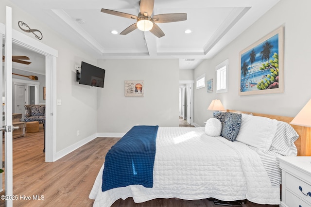 bedroom featuring recessed lighting, light wood-style floors, ceiling fan, coffered ceiling, and baseboards