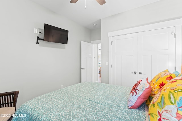 bedroom featuring ceiling fan and a closet