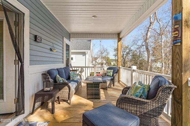 wooden deck with an outdoor hangout area