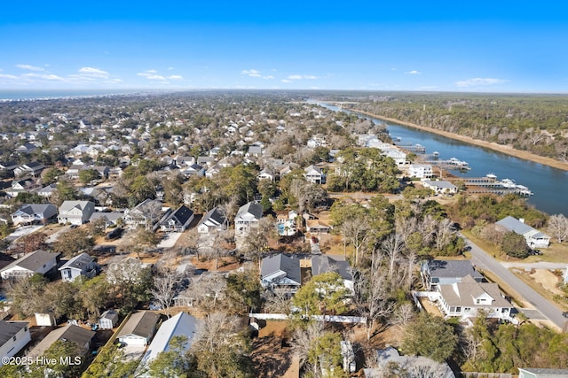 drone / aerial view featuring a water view and a residential view