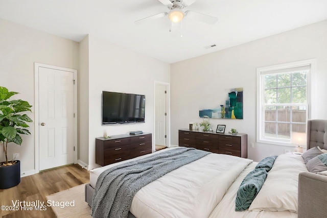 1010 Winterberry Cir, Leland, NC 28451 - bedroom with wood finished floors and a ceiling fan