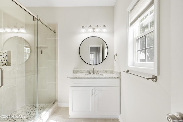 1010 Winterberry Cir, Leland, NC 28451 - full bath featuring a shower stall, vanity, tile patterned floors, and baseboards