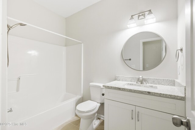 full bath with toilet, shower / bathing tub combination, tile patterned flooring, and vanity