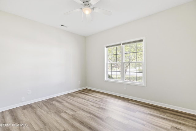 1010 Winterberry Cir, Leland, NC 28451 - unfurnished room with wood finished floors, baseboards, and a ceiling fan