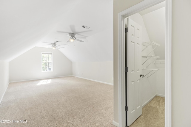 1010 Winterberry Cir, Leland, NC 28451 - bonus room featuring lofted ceiling, light carpet, a ceiling fan, and baseboards
