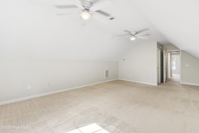 1010 Winterberry Cir, Leland, NC 28451 - additional living space featuring light carpet, a ceiling fan, baseboards, and lofted ceiling