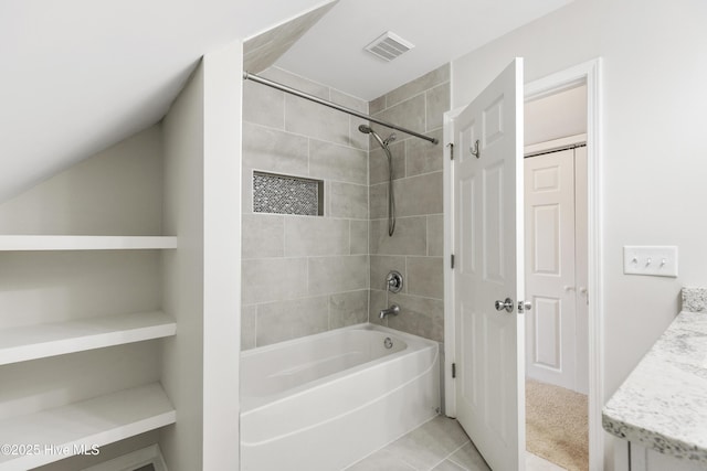 full bath featuring vanity, tile patterned flooring, bathtub / shower combination, and visible vents