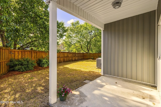 view of yard featuring a fenced backyard, cooling unit, and a patio area
