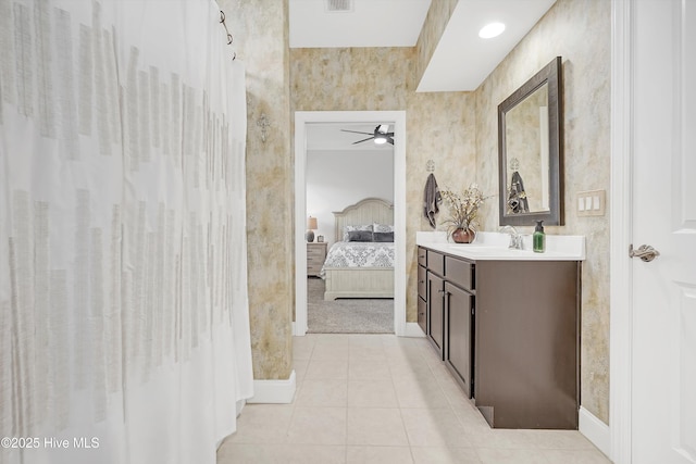 bathroom featuring ceiling fan, vanity, and tile patterned flooring