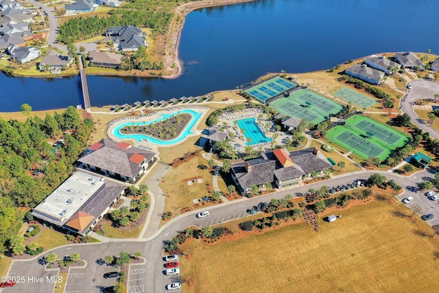 birds eye view of property with a water view