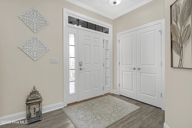 entrance foyer with crown molding and hardwood / wood-style flooring