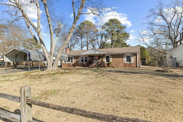 single story home with a carport, covered porch, and a front lawn