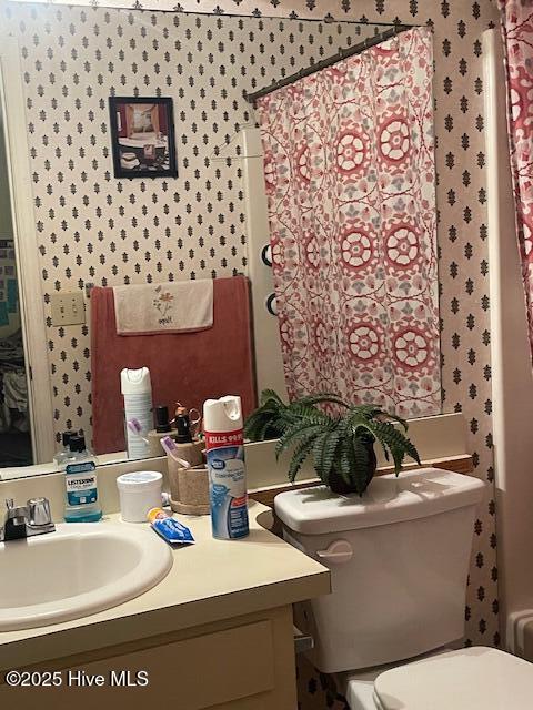 bathroom with vanity and toilet