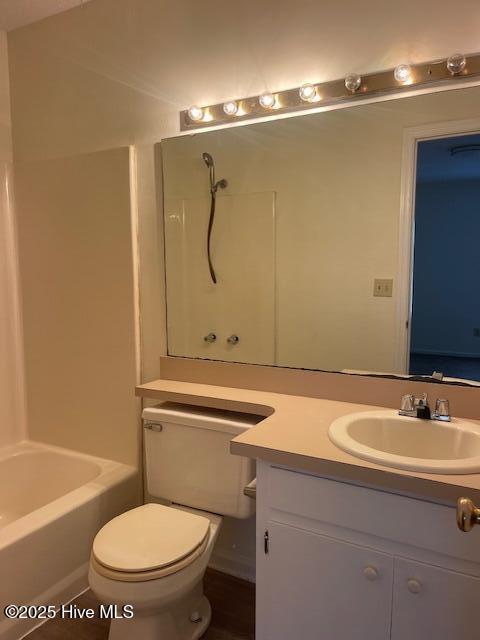 full bathroom with vanity, bathing tub / shower combination, and toilet