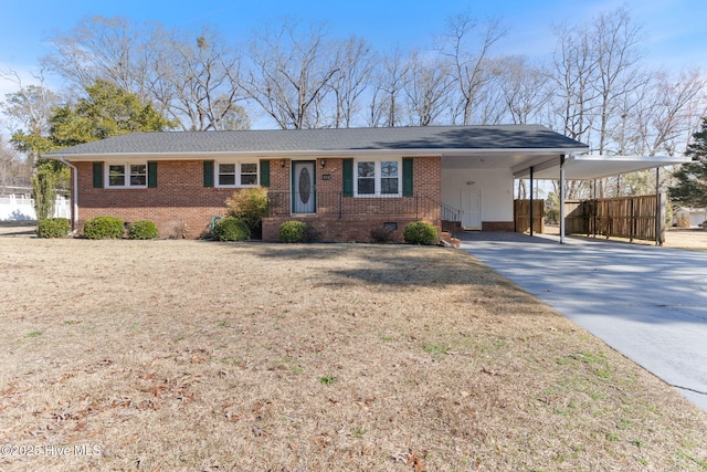 ranch-style home with a front yard and a carport