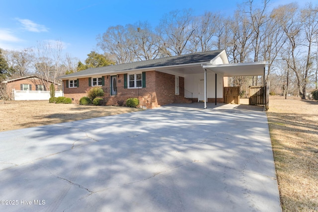 view of front of home with a carport