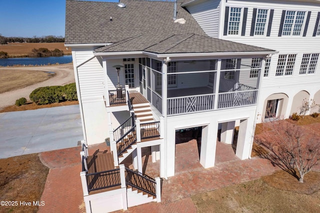 back of property featuring a sunroom