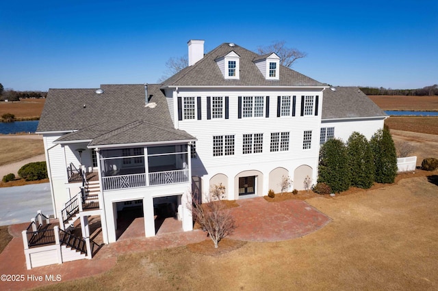 back of house featuring a patio and a sunroom