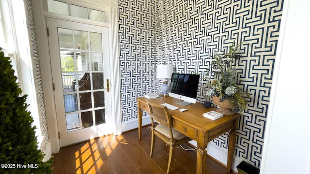 home office with dark hardwood / wood-style flooring