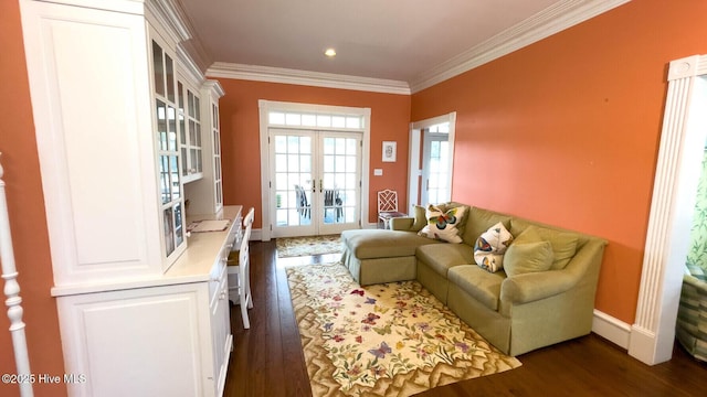 sitting room featuring crown molding, dark hardwood / wood-style floors, and french doors