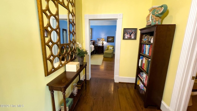 corridor featuring dark wood-type flooring