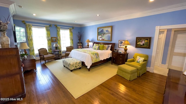 bedroom with crown molding and dark hardwood / wood-style floors