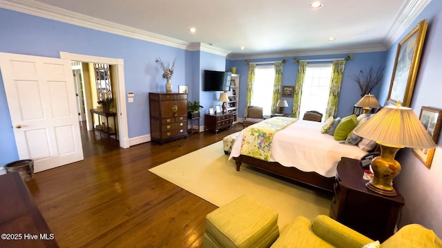 bedroom featuring dark wood-type flooring and ornamental molding