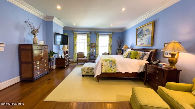 bedroom with ornamental molding and dark hardwood / wood-style flooring