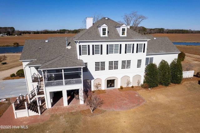 back of house featuring a patio and a sunroom