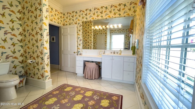 bathroom featuring vanity, tile patterned floors, ornamental molding, and toilet