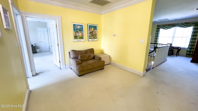 sitting room featuring crown molding and carpet flooring