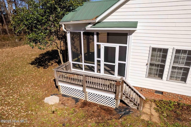 exterior space featuring a sunroom