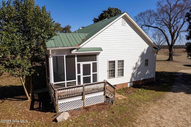 back of house with a sunroom