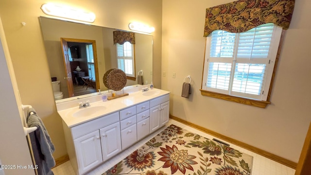 bathroom with vanity and toilet